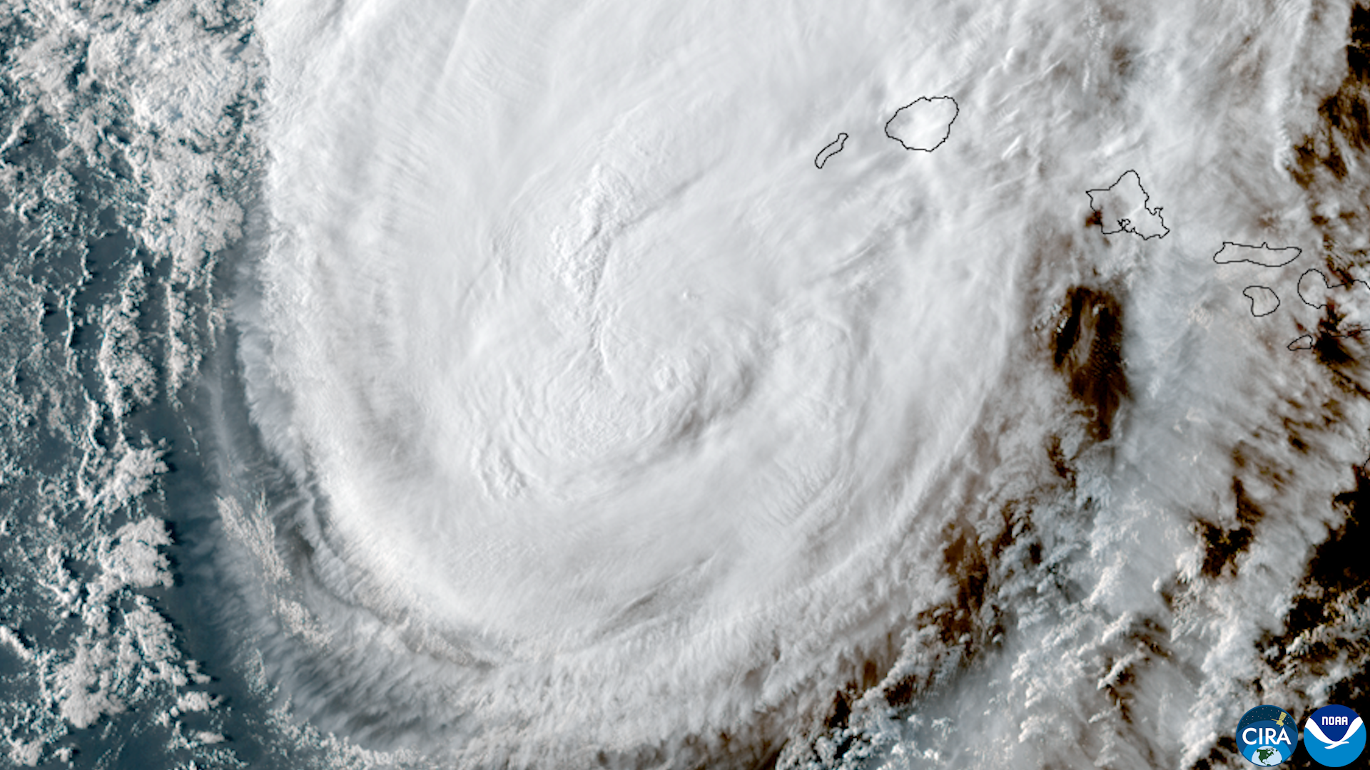Satellite image of Hurricane Lowell near the western Hawaiian Islands, showing the storm's circulation close to Kauaʻi and surrounding islands.