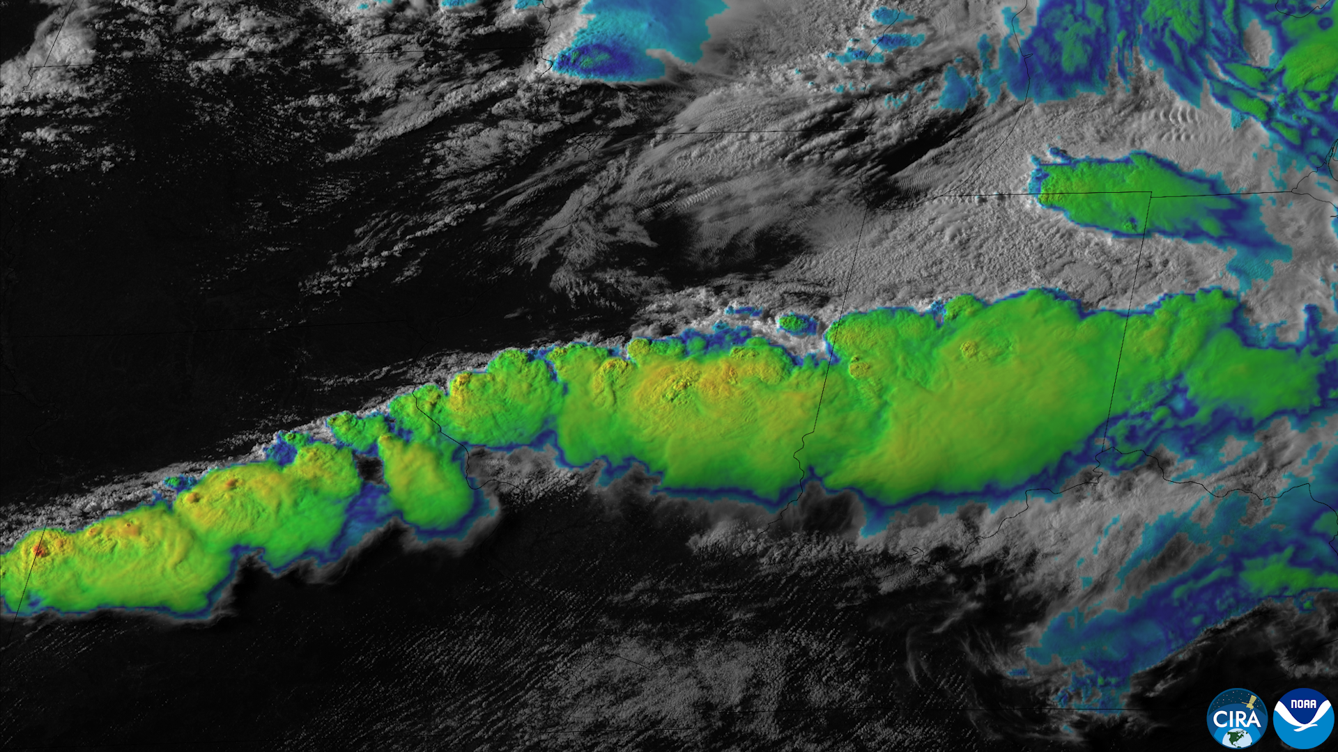 Satellite/remote-sensing image showing a line of severe thunderstorms firing up across the Midwest, with large convective towers and cloud structures indicative of severe weather.