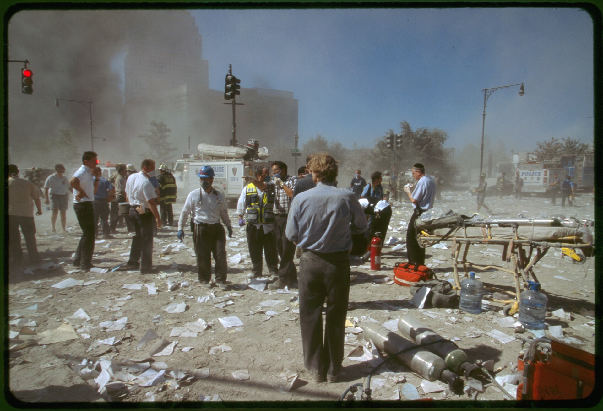 The World Trade Center Twin Towers burning on September 11, 2001, with smoke and fire rising after the airplane impacts, as seen from uptown Manhattan.