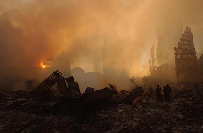 Sunlight filtering through dust and smoke over the wreckage of the World Trade Center on September 13, 2001.